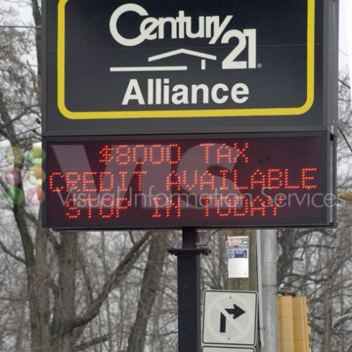 Century 21 sign with tax credit message.