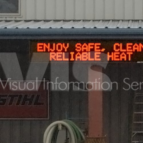 Sign displaying "Enjoy Safe, Clean, Reliable Heat.