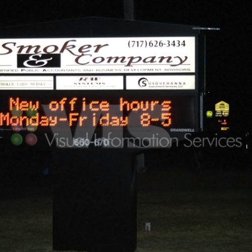 Sign displaying new office hours and contact.