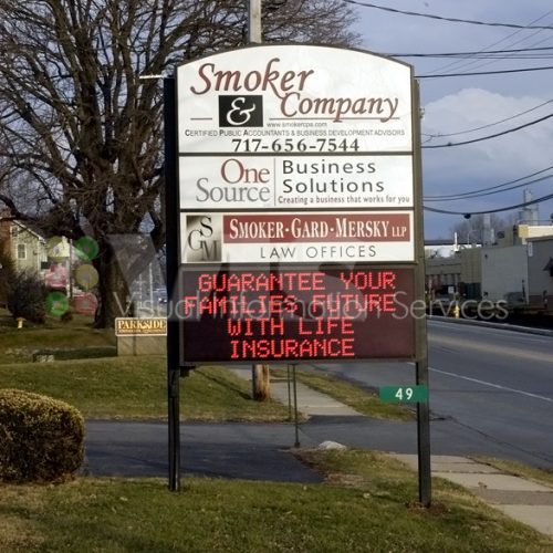 Business signs with life insurance message.