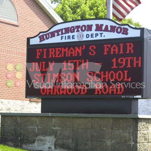 Fire department sign advertising Fireman's Fair.
