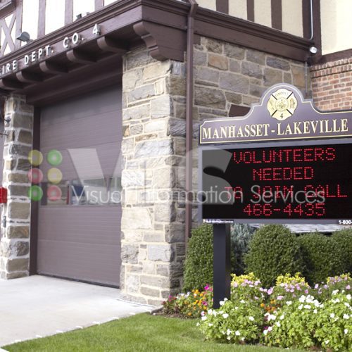 Fire department building with volunteer sign.