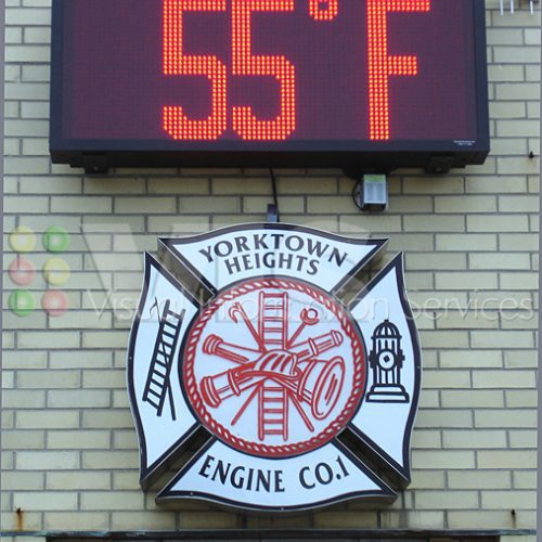 Fire station sign with 55°F temperature display.