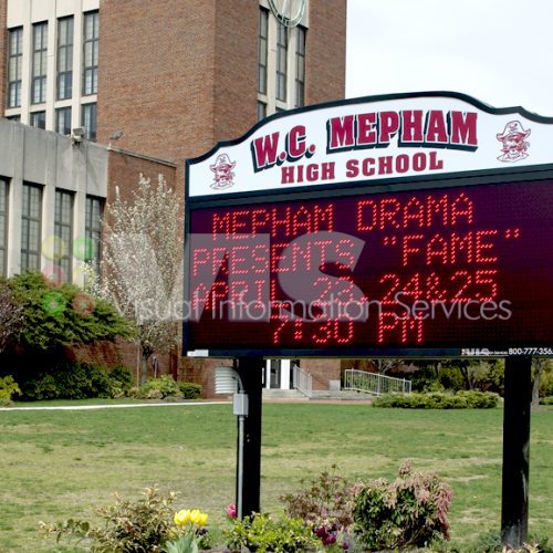 W.C. Mepham High School signboard outside building.