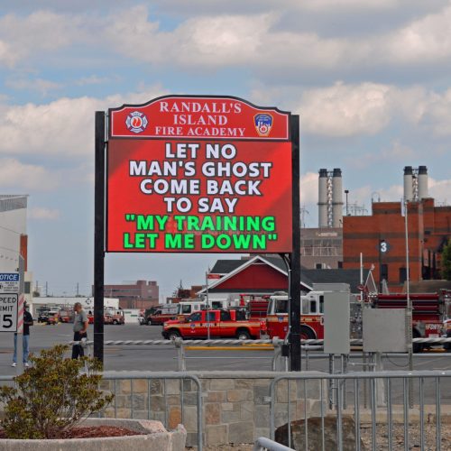 Fire Academy sign with safety message displayed.