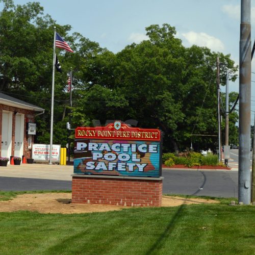 Fire station sign promoting pool safety.
