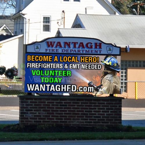 Fire department volunteer recruitment sign with firefighter.