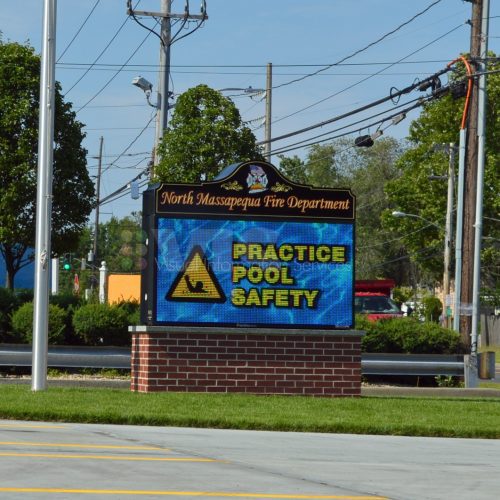 Fire department sign promoting pool safety.