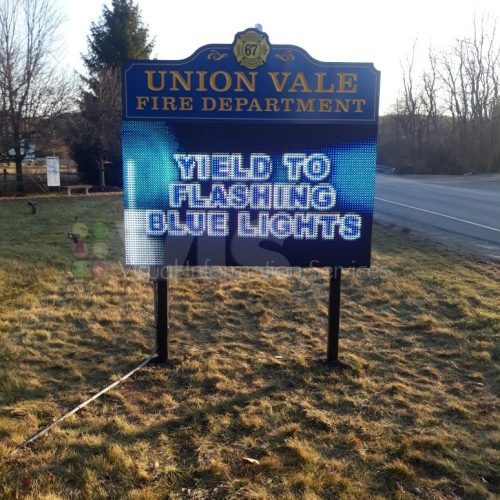 Fire department sign: "Yield to flashing lights.