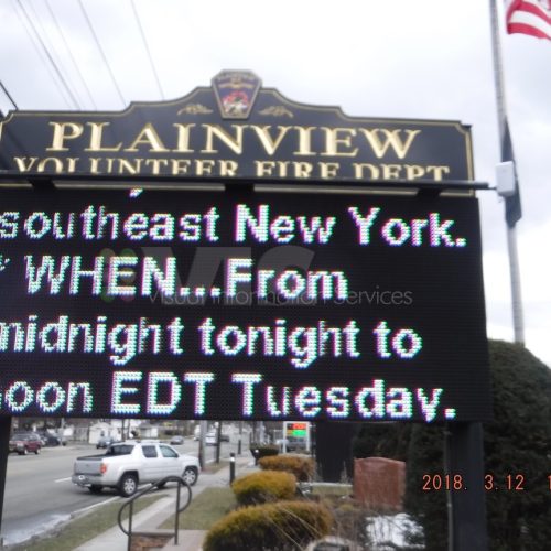 Fire department sign with weather alert message.