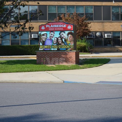 School sign saying "We miss you students!