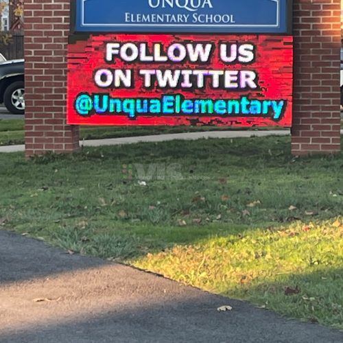 School sign promoting Twitter account.