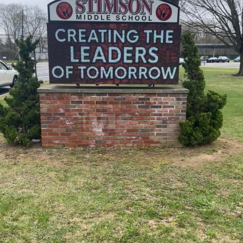 Stimson Middle School sign on grassy area.