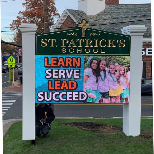 St. Patrick's School sign with motto.